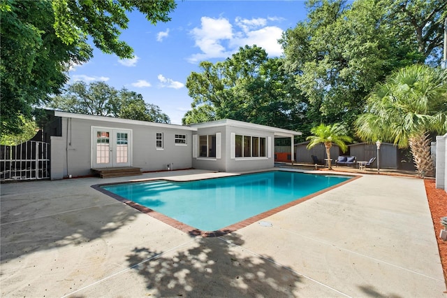3251 Wickersham Ct, Orlando, FL 32806 - view of swimming pool with french doors and a patio area