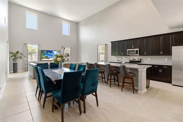5639 Timber Meadow Way, Saint Cloud, FL 34771 - dining space featuring a towering ceiling and light tile patterned floors