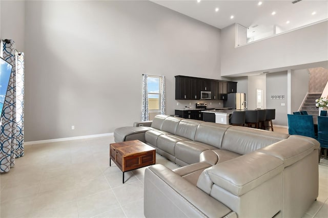 5639 Timber Meadow Way, Saint Cloud, FL 34771 - living room featuring a towering ceiling and light tile patterned floors