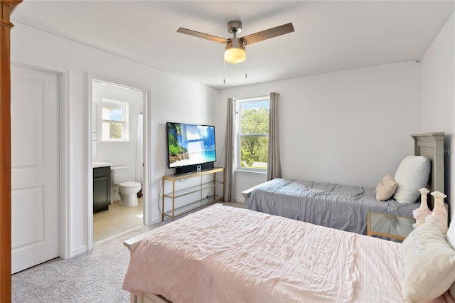 5639 Timber Meadow Way, Saint Cloud, FL 34771 - bedroom with ensuite bathroom, light colored carpet, and ceiling fan