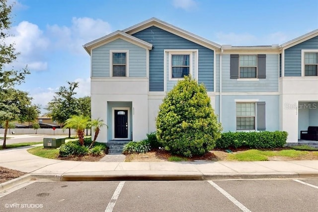 8900 Sydney Ave, Kissimmee, FL 34747 - townhome / multi-family property with uncovered parking and stucco siding