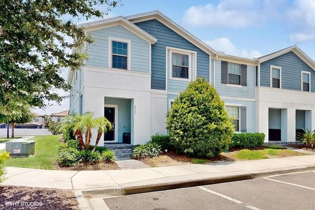 8900 Sydney Ave, Kissimmee, FL 34747 - multi unit property with stucco siding and uncovered parking