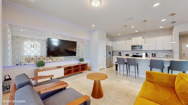 8900 Sydney Ave, Kissimmee, FL 34747 - living room with recessed lighting and light tile patterned floors