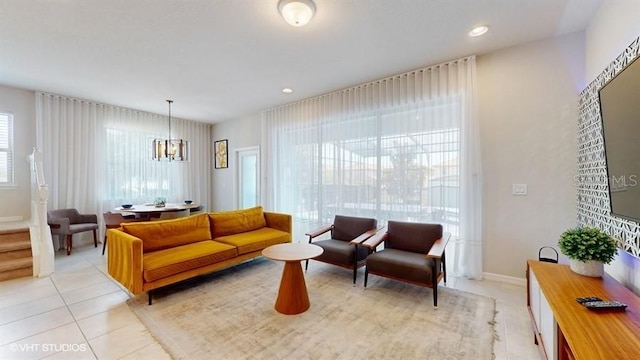 8900 Sydney Ave, Kissimmee, FL 34747 - living room featuring light tile patterned floors, a chandelier, and recessed lighting