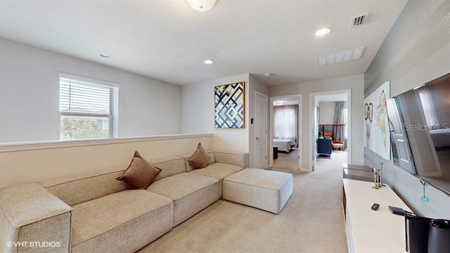 8900 Sydney Ave, Kissimmee, FL 34747 - living room featuring light colored carpet and recessed lighting