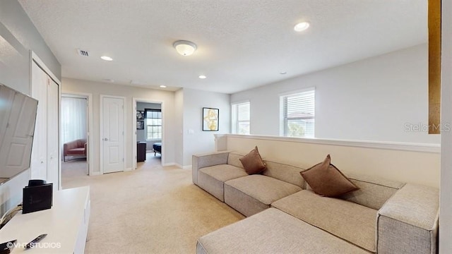 8900 Sydney Ave, Kissimmee, FL 34747 - living area featuring light carpet and recessed lighting