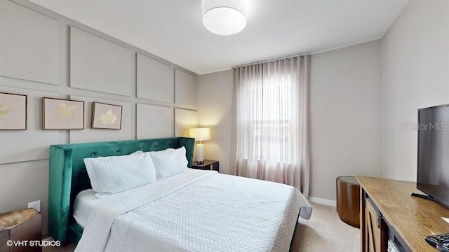 8900 Sydney Ave, Kissimmee, FL 34747 - bedroom featuring light colored carpet and baseboards