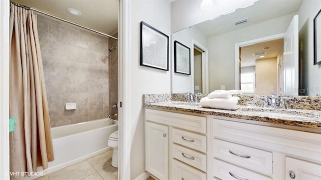 8900 Sydney Ave, Kissimmee, FL 34747 - full bathroom featuring double vanity, tile patterned flooring, and shower / bath combination with curtain