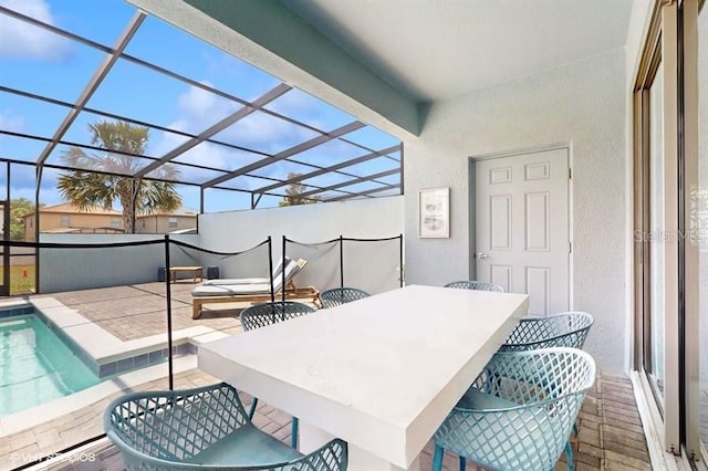 8900 Sydney Ave, Kissimmee, FL 34747 - view of patio / terrace featuring an outdoor pool, a lanai, and outdoor dining area
