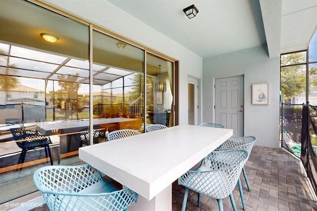8900 Sydney Ave, Kissimmee, FL 34747 - sunroom with outdoor dining space