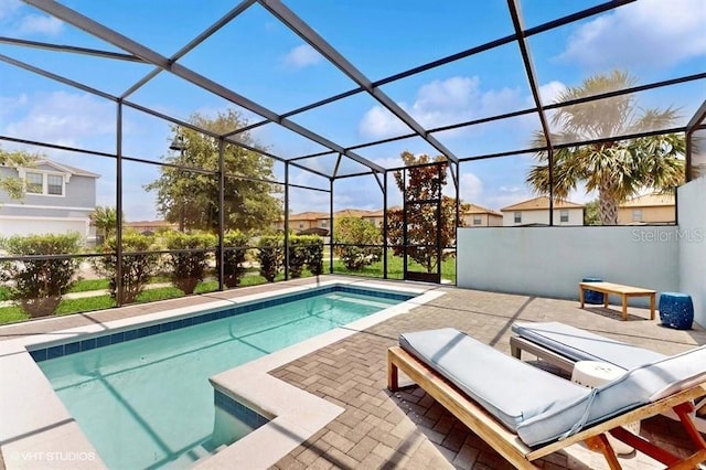 8900 Sydney Ave, Kissimmee, FL 34747 - swimming pool featuring a patio and glass enclosure