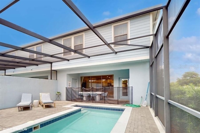 8900 Sydney Ave, Kissimmee, FL 34747 - back of house featuring stucco siding, a patio area, and an outdoor pool