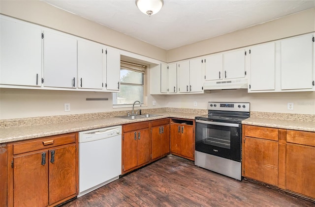 13 Scott Ln, Rockledge, FL 32955 - kitchen with stainless steel electric range oven, dishwasher, under cabinet range hood, a sink, and dark wood-type flooring