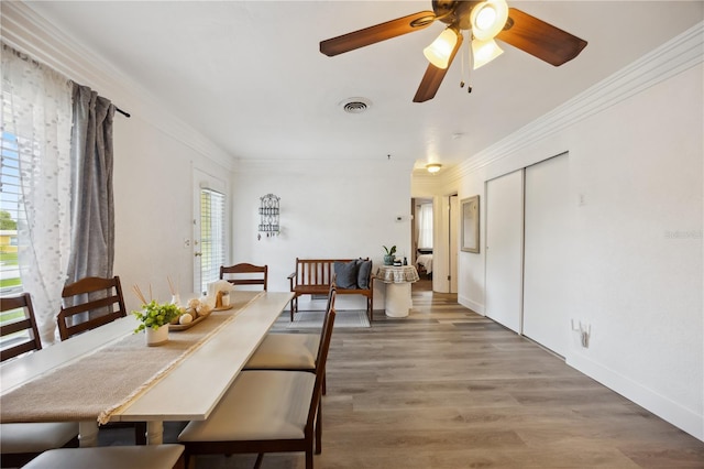 1649 W Waycross Cir, Deltona, FL 32725 - dining space with crown molding, light wood-style flooring, a ceiling fan, and baseboards