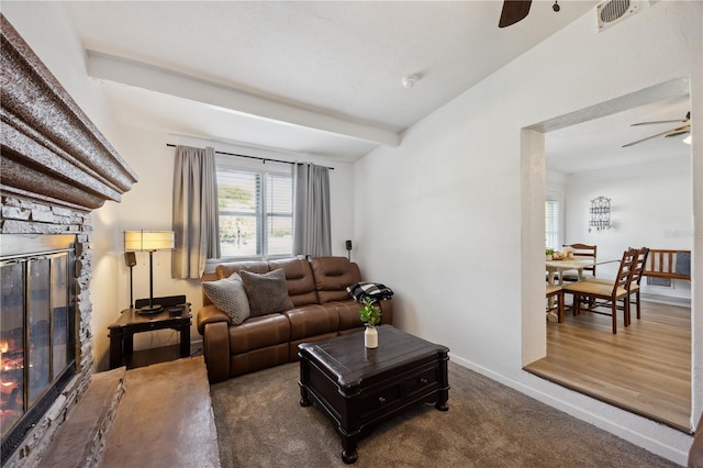 1649 W Waycross Cir, Deltona, FL 32725 - carpeted living area featuring ceiling fan, a stone fireplace, and baseboards