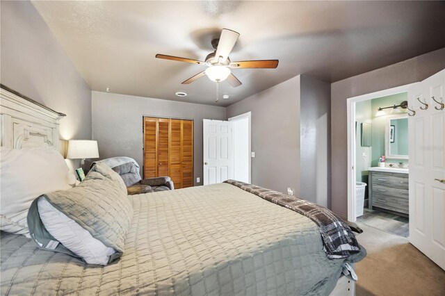 1649 W Waycross Cir, Deltona, FL 32725 - bedroom featuring carpet floors, a closet, a ceiling fan, connected bathroom, and a sink