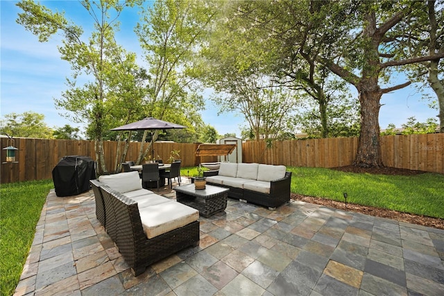 1649 W Waycross Cir, Deltona, FL 32725 - fenced backyard featuring a grill, a patio, outdoor dining space, and an outdoor living space