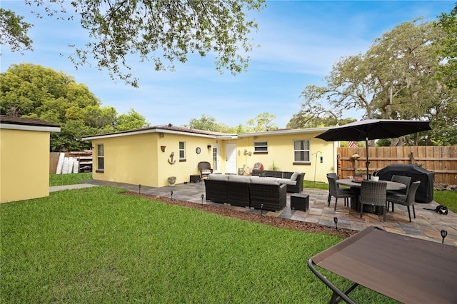 1649 W Waycross Cir, Deltona, FL 32725 - rear view of house featuring outdoor lounge area, a patio, and stucco siding