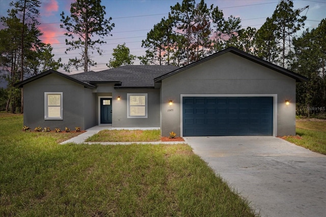 17477 SW 41st Cir, Ocala, FL 34473 - ranch-style home featuring concrete driveway, a garage, a lawn, and stucco siding