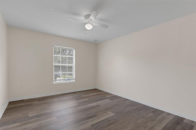 2255 Tealwood Cir, Tavares, FL 32778 - empty room with ceiling fan, wood finished floors, and baseboards