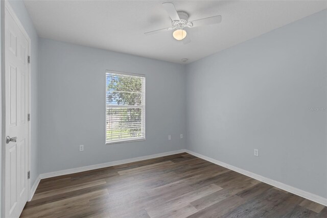 2255 Tealwood Cir, Tavares, FL 32778 - unfurnished room with wood finished floors, baseboards, and ceiling fan
