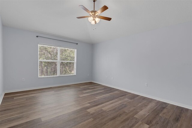 2255 Tealwood Cir, Tavares, FL 32778 - spare room featuring wood finished floors, ceiling fan, lofted ceiling, and baseboards