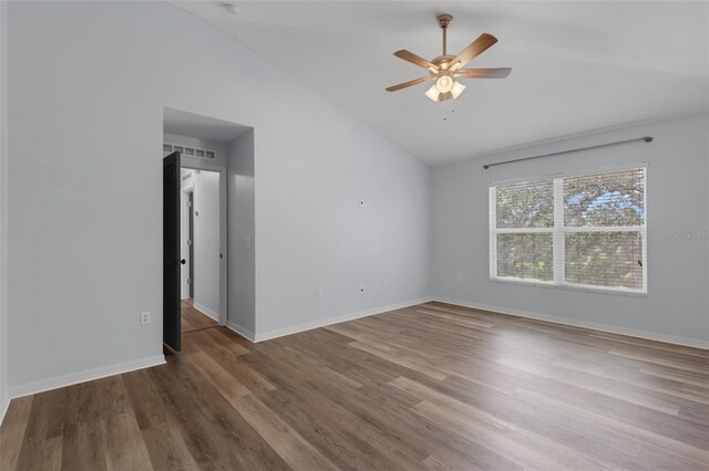 2255 Tealwood Cir, Tavares, FL 32778 - unfurnished room featuring vaulted ceiling, ceiling fan, wood finished floors, and baseboards