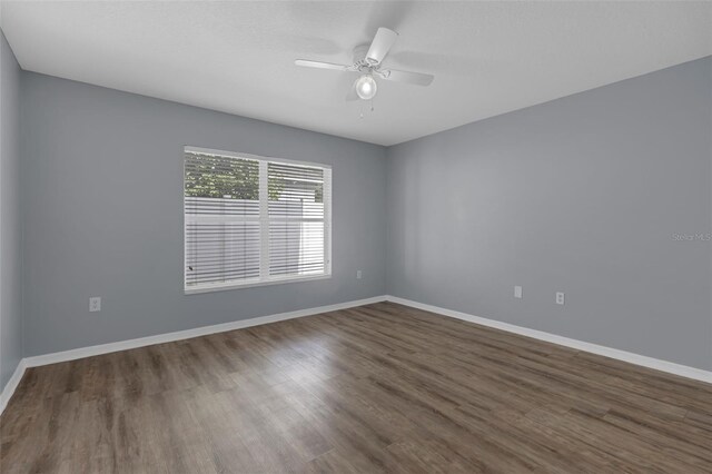 2255 Tealwood Cir, Tavares, FL 32778 - unfurnished room featuring wood finished floors, a ceiling fan, and baseboards