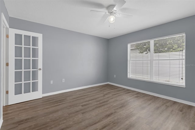 2255 Tealwood Cir, Tavares, FL 32778 - spare room with wood finished floors, ceiling fan, and baseboards