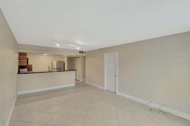 345 Ocean Dr Unit 305, Miami Beach, FL 33139 - unfurnished living room with baseboards and a sink