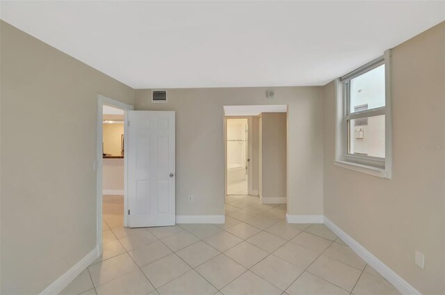 345 Ocean Dr Unit 305, Miami Beach, FL 33139 - unfurnished room with light tile patterned floors and baseboards