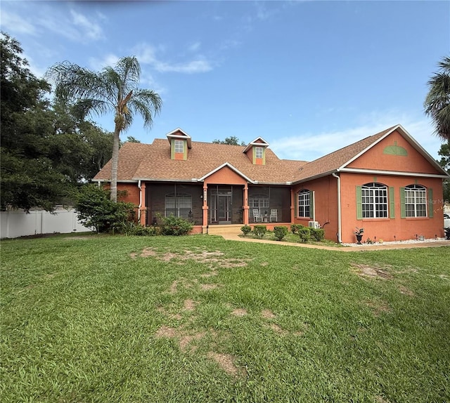 1031 Kings Hwy, Kissimmee, FL 34744 - view of front of house featuring a sunroom and stucco siding