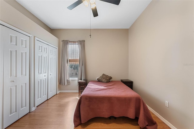1031 Kings Hwy, Kissimmee, FL 34744 - bedroom with two closets, light wood-style flooring, and ceiling fan