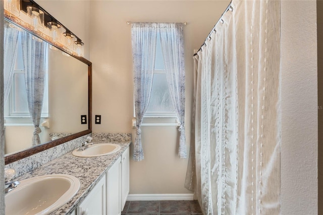 1031 Kings Hwy, Kissimmee, FL 34744 - full bathroom with double vanity and tile patterned floors
