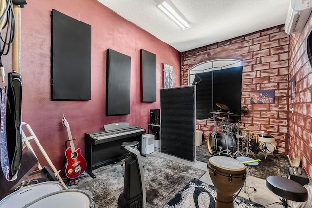 1031 Kings Hwy, Kissimmee, FL 34744 - miscellaneous room featuring an AC wall unit, a textured ceiling, and concrete flooring