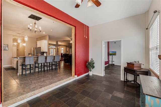 1031 Kings Hwy, Kissimmee, FL 34744 - interior space featuring healthy amount of natural light, a chandelier, and dark stone finish flooring