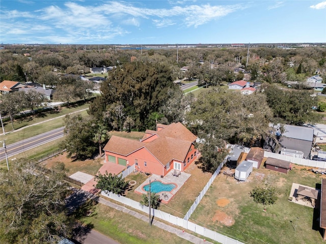 1031 Kings Hwy, Kissimmee, FL 34744 - aerial perspective of suburban area featuring a pool area and a tree filled landscape