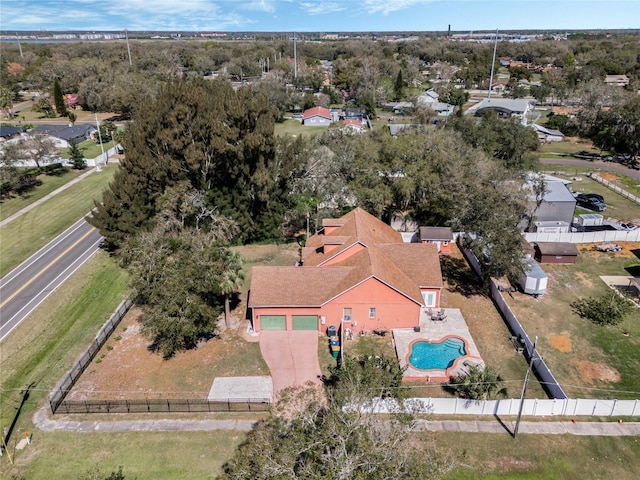 1031 Kings Hwy, Kissimmee, FL 34744 - drone / aerial view of a pool and a tree filled landscape