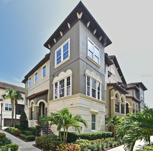 312 Trieste Loop, Lake Mary, FL 32746 - view of front of property with stucco siding