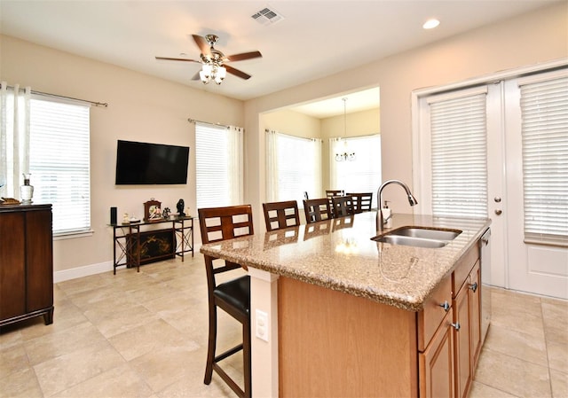 312 Trieste Loop, Lake Mary, FL 32746 - kitchen with a sink, ceiling fan, a breakfast bar area, plenty of natural light, and recessed lighting