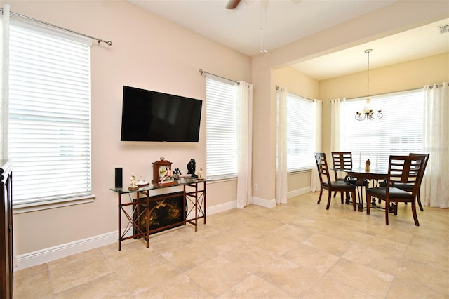 312 Trieste Loop, Lake Mary, FL 32746 - dining space with a chandelier, ceiling fan, baseboards, and plenty of natural light