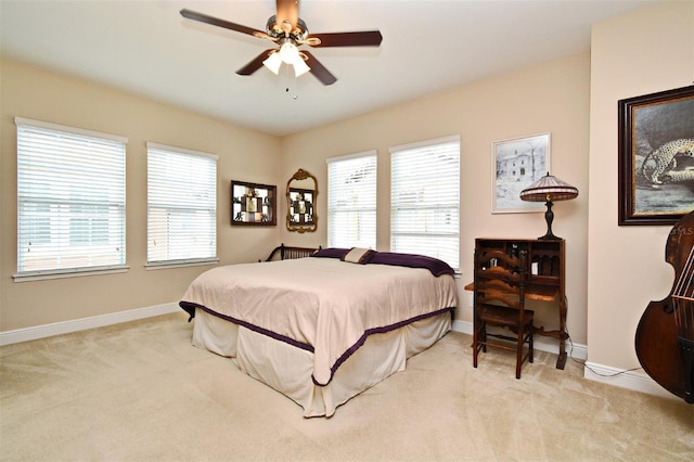 312 Trieste Loop, Lake Mary, FL 32746 - bedroom featuring light colored carpet, baseboards, and a ceiling fan