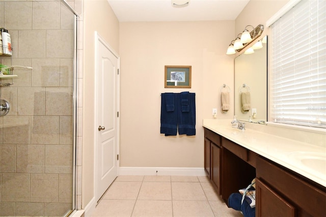 312 Trieste Loop, Lake Mary, FL 32746 - full bath with double vanity, a shower stall, tile patterned flooring, and baseboards