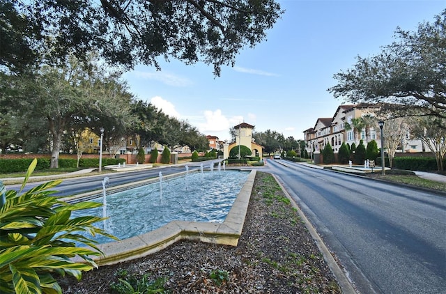 312 Trieste Loop, Lake Mary, FL 32746 - view of asphalt road featuring street lights, sidewalks, and curbs