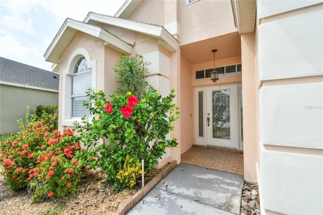 831 Corvina Dr, Davenport, FL 33897 - property entrance featuring stucco siding