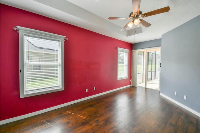 831 Corvina Dr, Davenport, FL 33897 - empty room featuring wood finished floors and ceiling fan