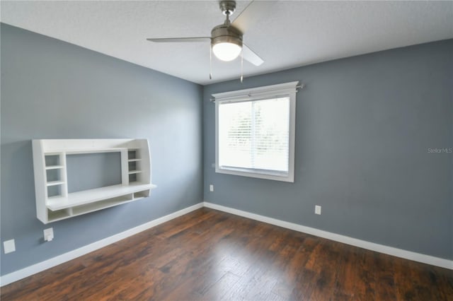 831 Corvina Dr, Davenport, FL 33897 - unfurnished room with ceiling fan and dark wood-style flooring