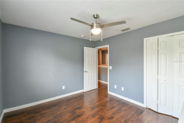 831 Corvina Dr, Davenport, FL 33897 - unfurnished bedroom with a closet, wood finished floors, and ceiling fan
