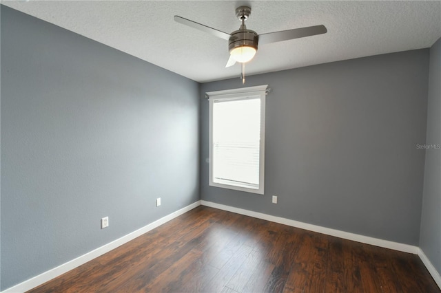831 Corvina Dr, Davenport, FL 33897 - unfurnished room featuring a ceiling fan, dark wood finished floors, and a textured ceiling