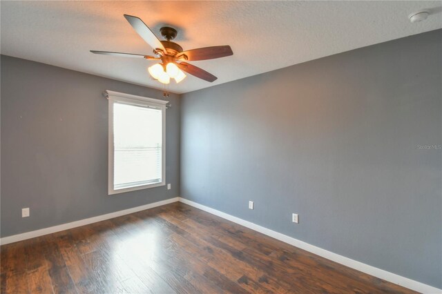 831 Corvina Dr, Davenport, FL 33897 - spare room with ceiling fan, dark wood-style flooring, and a smoke detector